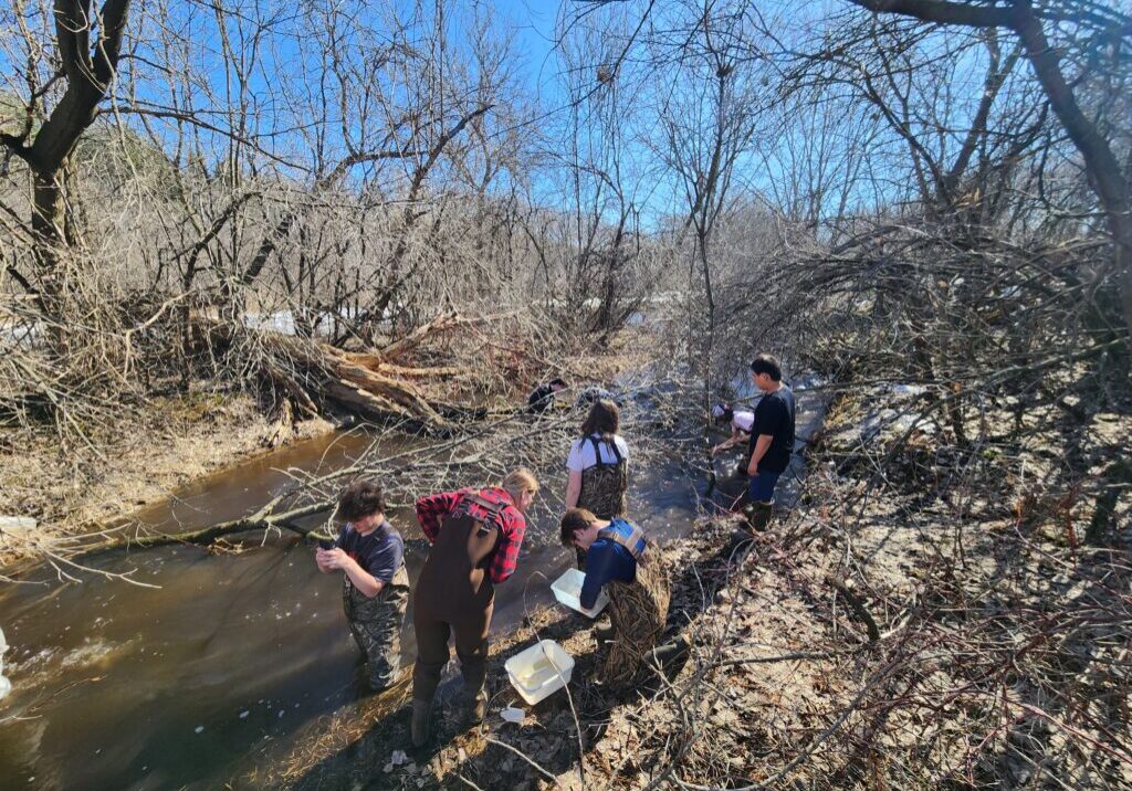 High school students helping with stream monitoring