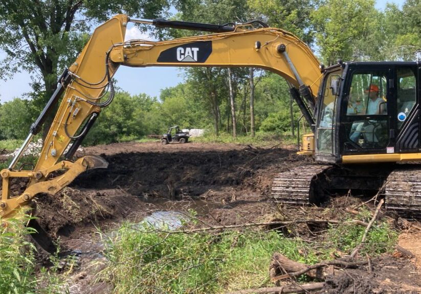 Excavator restoring Brown's Creek