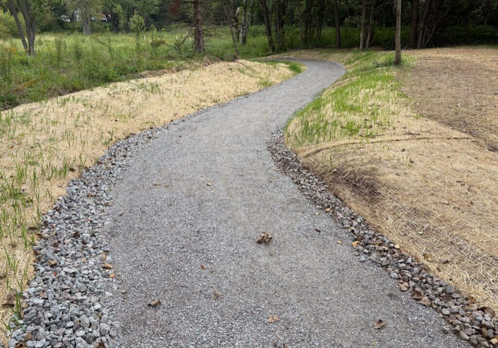 The ADA accessible crushed gravel path leading to the creek