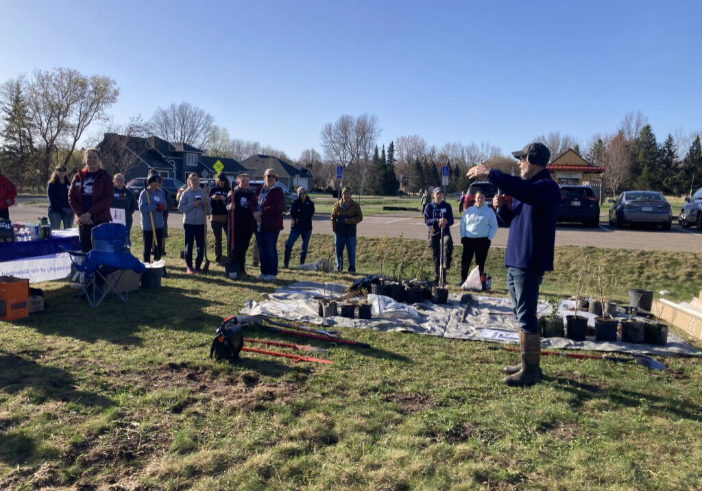 Volunteers learning about the planting plan